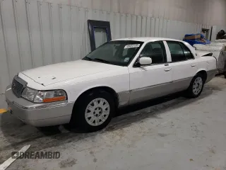 2005 Mercury Grand Marquis GS with VIN 2MEFM74W05X612471, listed as a Copart auction lot 49455195 with 140,916 mi miles and Salvage Title. Bid and sale history available at DreamBid. Image 1.