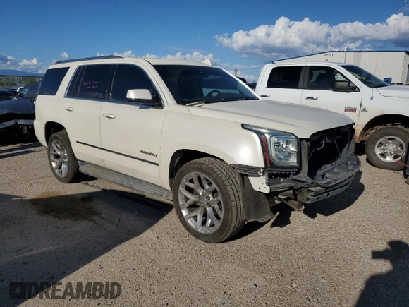 2015 GMC Yukon Denali with VIN 1GKS2CKJ0FR508598, listed as a Copart auction lot 71212924 with 133,220 mi miles and Salvage Title. Bid and sale history available at carsss.com. Image 4.