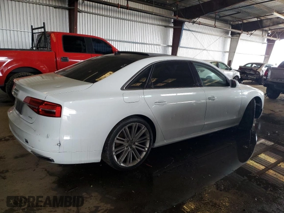 2017 Audi A8 with VIN WAU44AFD2HN009512, listed as a Copart auction lot 84442474 with 44,174 mi miles and Salvage title. Bid and sale history available at DreamBid. Image 3.