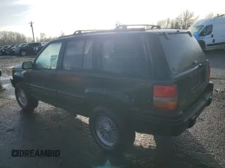 1998 Jeep Grand Cherokee Limited with VIN 1J4GZ78S0WC138917, listed as a Copart auction lot 86223974 with 152,482 mi miles and Clean Title. Bid and sale history available at carsss.com. Image 2.