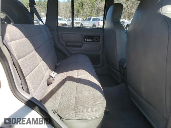 1995 Jeep Cherokee Sport with VIN 1J4FJ68S0SL646747, listed as a Copart auction lot 48772675 with 239,834 mi miles and Salvage title. Bid and sale history available at DreamBid. Image 11.