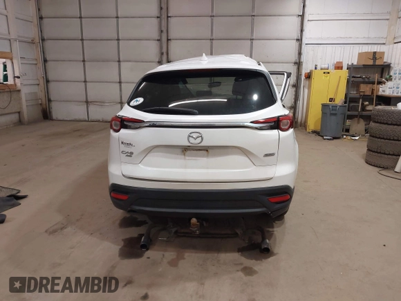 2016 Mazda CX-9 Touring with VIN JM3TCBCY3G0114707, listed as a IAAI auction lot 42023034 with 225,281 mi miles and . Bid and sale history available at DreamBid. Image 16.