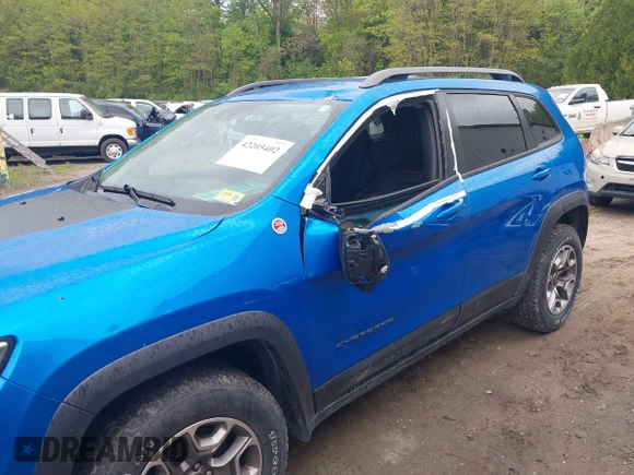 2021 Jeep Cherokee Trailhawk with VIN 1C4PJMBXXMD173102, listed as a IAAI auction lot 42205402 with 57,321 mi miles and . Bid and sale history available at DreamBid. Image 6.