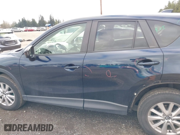 2015 Mazda CX-5 Touring with VIN JM3KE4CY5F0453646, listed as a IAAI auction lot 41740574 with 91,167 mi miles. Bid and sale history available at carsss.com. Image 15.