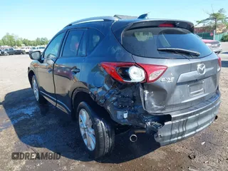 2014 Mazda CX-5 Grand Touring with VIN JM3KE4DY2E0312952, listed as a IAAI auction lot 42138721 with 99,993 mi miles and . Bid and sale history available at DreamBid. Image 3.