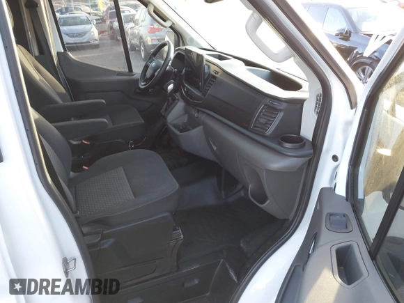2023 Ford Transit Cargo with VIN 1FTBR1C8XPKC07287, listed as a IAAI auction lot 41247582 with 12,776 mi miles and . Bid and sale history available at DreamBid. Image 5.