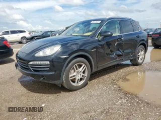 2013 Porsche Cayenne S Hybrid with VIN WP1AE2A20DLA14095, listed as a Copart auction lot 64215625 with 148,286 mi miles and Salvage title. Bid and sale history available at DreamBid. Image 1.