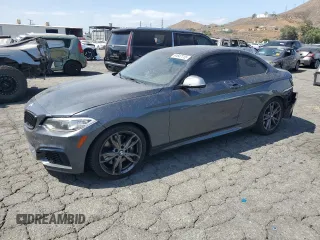 2015 BMW 2 Series M235i with VIN WBA1J7C53FV289367, listed as a Copart auction lot 61647115 with 114,008 mi miles and Salvage title. Bid and sale history available at DreamBid. Image 1.