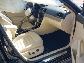 2016 Volkswagen Passat 1.8T SEL Premium with VIN 1VWCS7A31GC035550, listed as a IAAI auction lot 41478977 with 126,190 mi miles. Bid and sale history available at carsss.com. Image 5.