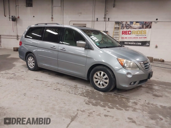 2009 Honda Odyssey EX-L with VIN 5FNRL38789B015524, listed as a IAAI auction lot 42135465 with 242,005 mi miles. Bid and sale history available at carsss.com. Image 1.