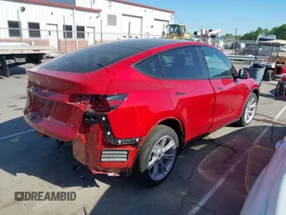 2023 Tesla Model Y Long Range with VIN 7SAYGDEEXPA182702, listed as a IAAI auction lot 42023730 with Not provided miles and . Bid and sale history available at DreamBid. Image 4.