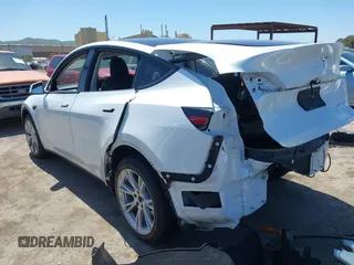 2023 Tesla Model Y Long Range with VIN 7SAYGDEE1PF660444, listed as a IAAI auction lot 42065046 with 23,601 mi miles and . Bid and sale history available at DreamBid. Image 3.