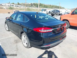 2018 Ford Fusion Hybrid SE with VIN 3FA6P0LU5JR257120, listed as a IAAI auction lot 41859050 with 142,524 mi miles. Bid and sale history available at carsss.com. Image 3.
