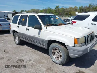 1996 Jeep Grand Cherokee Laredo with VIN 1J4EX58S6TC126610, listed as a IAAI auction lot 41801779 with 1 mi miles. Bid and sale history available at carsss.com. Image 1.