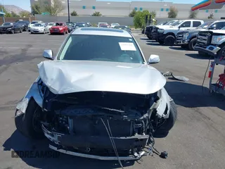 2015 Infiniti Q50 Premium with VIN JN1BV7AP8FM339334, listed as a IAAI auction lot 41956950 with 99,945 mi miles. Bid and sale history available at carsss.com. Image 12.