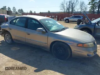 2003 Pontiac Bonneville SE z VIN 1G2HX52K534120064, wystawiony jako IAAI lot #41765041 z przebiegiem 95 052 mil mil oraz . Historia ofert i sprzedaży dostępna na DreamBid. Obrazek 1.
