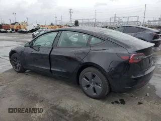 2023 Tesla Model 3 with VIN 5YJ3E1EA1PF677592, listed as a Copart auction lot 47621875 with 12,247 mi miles and Salvage Title. Bid and sale history available at DreamBid. Image 2.