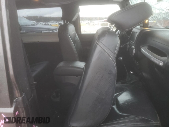 2014 Jeep Wrangler Rubicon with VIN 1C4BJWCG9EL189819, listed as a Copart auction lot 80522204 with 82,083 mi miles and Salvage title. Bid and sale history available at DreamBid. Image 11.