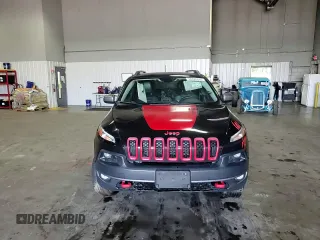 2015 Jeep Cherokee Trailhawk with VIN 1C4PJMBS5FW587545, listed as a Copart auction lot 58820685 with 136,755 mi miles and Salvage title. Bid and sale history available at DreamBid. Image 14.