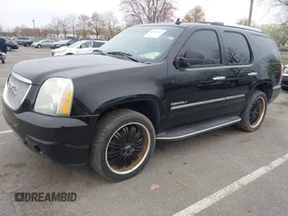 2012 GMC Yukon Denali with VIN 1GKS2EEF5CR129160, listed as a IAAI auction lot 42012417 with 221,871 mi miles. Bid and sale history available at carsss.com. Image 2.
