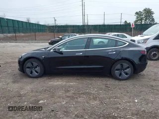 2019 Tesla Model 3 Mid Range with VIN 5YJ3E1EA2KF395549, listed as a IAAI auction lot 41895977 with 97,108 mi miles and . Bid and sale history available at carsss.com. Image 14.