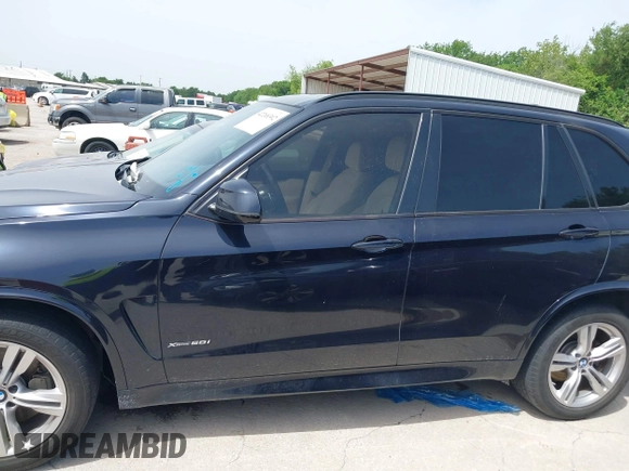 2014 BMW X5 xDrive50i with VIN 5UXKR6C55E0C03743, listed as a IAAI auction lot 42268302 with 118,892 mi miles and . Bid and sale history available at DreamBid. Image 14.