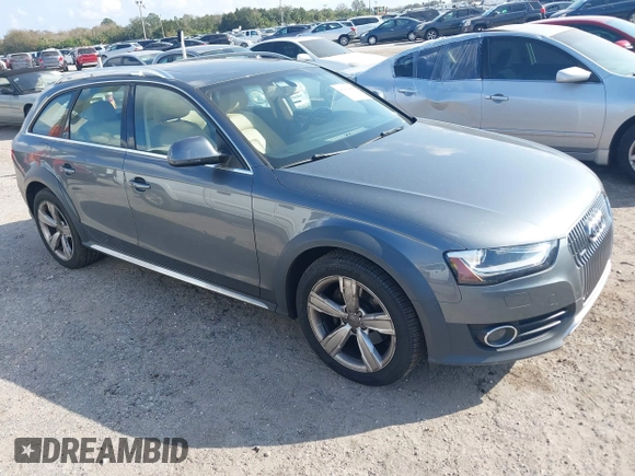 2014 Audi allroad A4 Premium Plus z VIN WA1UFAFL7EA006011, wystawiony jako IAAI lot #41494881 z przebiegiem 70 461 mil mil oraz . Historia ofert i sprzedaży dostępna na DreamBid. Obrazek 1.