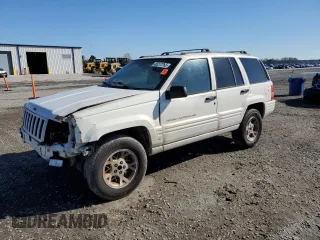 1998 Jeep Grand Cherokee Limited with VIN 1J4GZ78Y0WC307578, listed as a Copart auction lot 45272765 with 328,264 mi miles and Salvage Title. Bid and sale history available at carsss.com. Image 1.