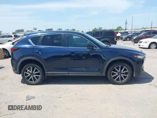 2018 Mazda CX-5 Touring z VIN JM3KFACM7J1410275, wystawiony jako IAAI lot #42248830 z przebiegiem 101 125 mil mil oraz . Historia ofert i sprzedaży dostępna na DreamBid. Obrazek 13.