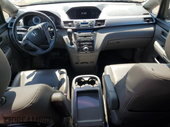 2012 Honda Odyssey Touring with VIN 5FNRL5H90CB093963, listed as a Copart auction lot 55434725 with 202,867 mi miles and Salvage Title. Bid and sale history available at DreamBid. Image 8.