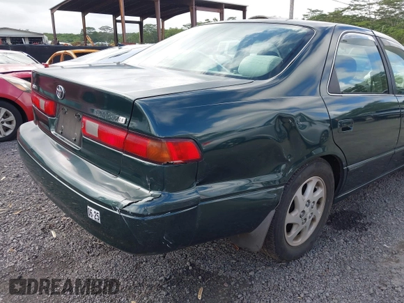 1999 Toyota Camry LE z VIN JT2BF22K2X0164080, wystawiony jako IAAI lot #40984874 z przebiegiem Nie podano mil oraz . Historia ofert i sprzedaży dostępna na DreamBid. Obrazek 13.