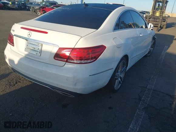 2015 Mercedes-Benz E-Class E 400 with VIN WDDKJ6FB3FF303383, listed as a IAAI auction lot 41818692 with 62,839 mi miles. Bid and sale history available at carsss.com. Image 4.