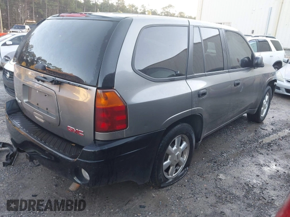 2005 GMC Envoy SLE with VIN 1GKDS13S352215032, listed as a IAAI auction lot 41221612 with 260,647 mi miles and . Bid and sale history available at DreamBid. Image 4.