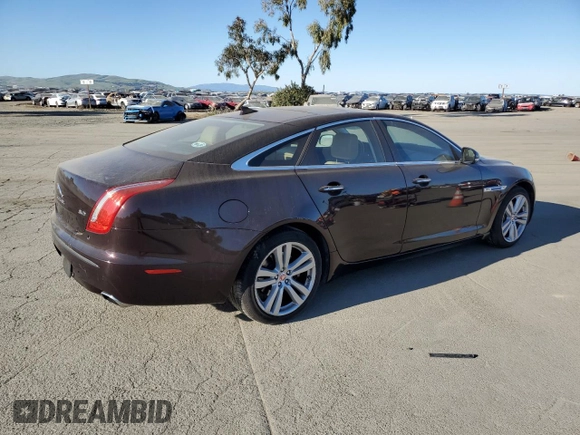 2014 Jaguar XJ with VIN SAJWA1CZ3E8V69877, listed as a Copart auction lot 48159005 with 57,567 mi miles and Clean Title. Bid and sale history available at DreamBid. Image 3.