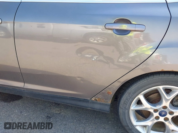 2014 Ford Focus Titanium with VIN 1FADP3N22EL317007, listed as a IAAI auction lot 42641134 with 159,705 mi miles and . Bid and sale history available at DreamBid. Image 6.