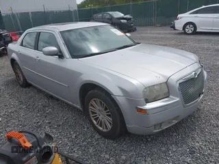 2008 Chrysler 300 Touring with VIN 2C3KA53G48H309834, listed as a IAAI auction lot 42200833 with 209,198 mi miles. Bid and sale history available at carsss.com. Image 1.