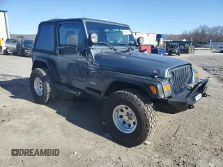 2002 Jeep Wrangler Sport with VIN 1J4FA49S22P703610, listed as a Copart auction lot 50900605 with 70,045 mi miles and Salvage Title. Bid and sale history available at carsss.com. Image 4.