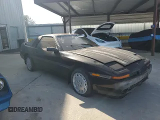 1989 Toyota Supra z VIN JT2MA71J3K0127383, wystawiony jako Copart lot #67868181 z przebiegiem 137 683 mil mil oraz Czysty tytuł • Clean title. Historia ofert i sprzedaży dostępna na DreamBid. Obrazek 1.