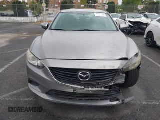 2014 Mazda 6 i Touring with VIN JM1GJ1V60E1141831, listed as a IAAI auction lot 42131200 with 86,597 mi miles and . Bid and sale history available at DreamBid. Image 12.