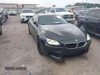2013 BMW M6 z VIN WBSLX9C50DC968777, wystawiony jako IAAI lot #41966918 z przebiegiem 113 458 mil mil oraz . Historia ofert i sprzedaży dostępna na DreamBid. Obrazek 1.