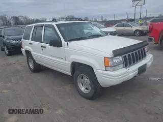 1998 Jeep Grand Cherokee Laredo with VIN 1J4GZ48S3WC204990, listed as a IAAI auction lot 41704176 with 185,376 mi miles. Bid and sale history available at carsss.com. Image 1.