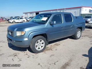 2006 Honda Ridgeline RTL with VIN 2HJYK16526H554016, listed as a IAAI auction lot 42053277 with 220,316 mi miles. Bid and sale history available at carsss.com. Image 2.