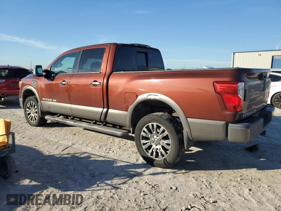 2016 Nissan Titan Platinum Reserve z VIN 1N6BA1F2XGN506885, wystawiony jako Copart lot #80171524 z przebiegiem 318 311 mil mil oraz Czysty tytuł • Clean title. Historia ofert i sprzedaży dostępna na DreamBid. Obrazek 2.