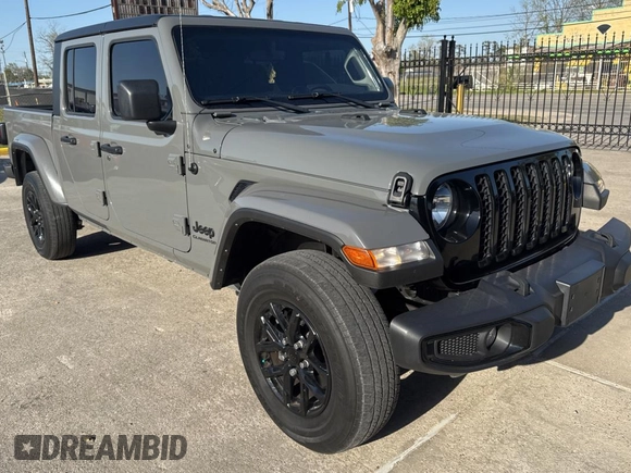 2022 Jeep Gladiator Willys z VIN 1C6HJTAG9NL160131, wystawiony jako Copart lot #50428855 z przebiegiem 56 970 mil mil oraz Czysty tytuł • Clean title. Historia ofert i sprzedaży dostępna na DreamBid. Obrazek 1.