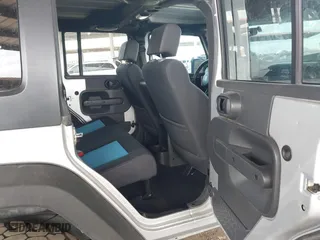 2010 Jeep Wrangler Unlimited Sport with VIN 1J4BA3H18AL161243, listed as a IAAI auction lot 41960370 with 89,004 mi miles. Bid and sale history available at carsss.com. Image 8.