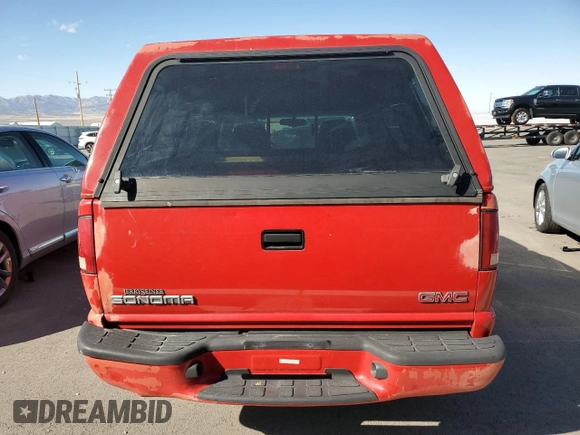 2000 GMC Sonoma SL z VIN 1GTCS145XYK251238, wystawiony jako Copart lot #77899534 z przebiegiem 61 827 mil mil oraz Szkody całkowita. Historia ofert i sprzedaży dostępna na DreamBid. Obrazek 6.