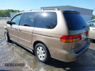 2003 Honda Odyssey EX-L z VIN 5FNRL180X3B055800, wystawiony jako IAAI lot #42053575 z przebiegiem 203 398 mil mil oraz . Historia ofert i sprzedaży dostępna na DreamBid. Obrazek 3.