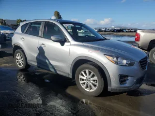 2016 Mazda CX-5 Sport with VIN JM3KE2BEXG0904597, listed as a Copart auction lot 86293834 with 63,343 mi miles and Salvage Title. Bid and sale history available at carsss.com. Image 4.