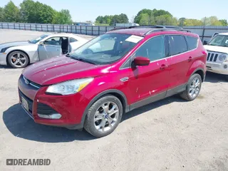 2015 Ford Escape SE with VIN 1FMCU0GXXFUA57386, listed as a IAAI auction lot 42043058 with 107,635 mi miles. Bid and sale history available at carsss.com. Image 2.