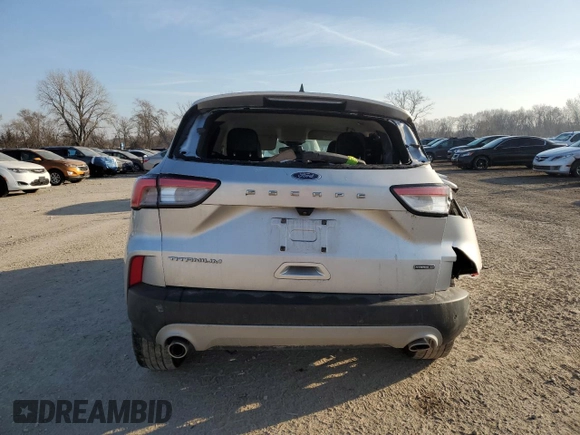2020 Ford Escape Titanium Hybrid z VIN 1FMCU9DZ4LUC34827, wystawiony jako Copart lot #48769685 z przebiegiem 84 218 mil mil oraz Szkoda całkowita • Salvage title. Historia ofert i sprzedaży dostępna na DreamBid. Obrazek 6.